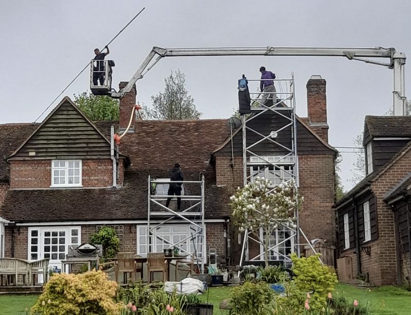 The Roof Moss Cleaners using cherry picker and scaffolding to clean roof safely and professionally in Bicester, Oxfordshire